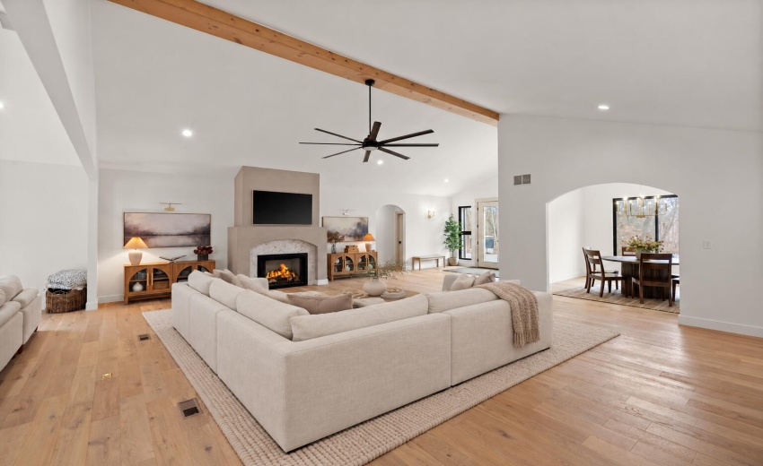 Elegant Ivory Sectional by Fireplace