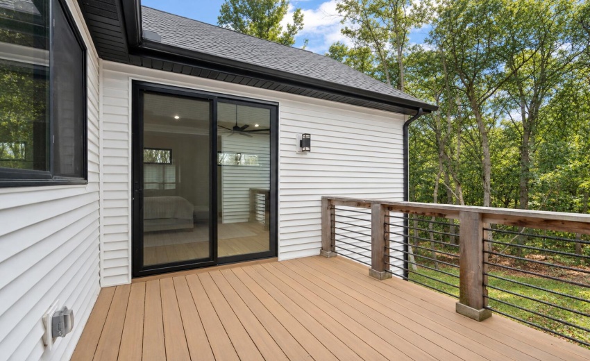 Late summer home with wooded deck