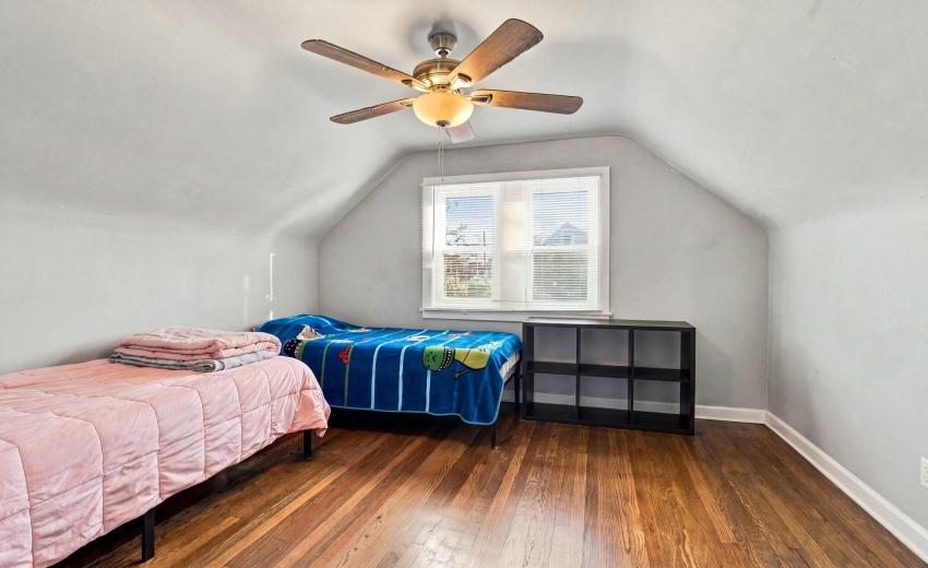 Upstairs bedroom with ceiling fan