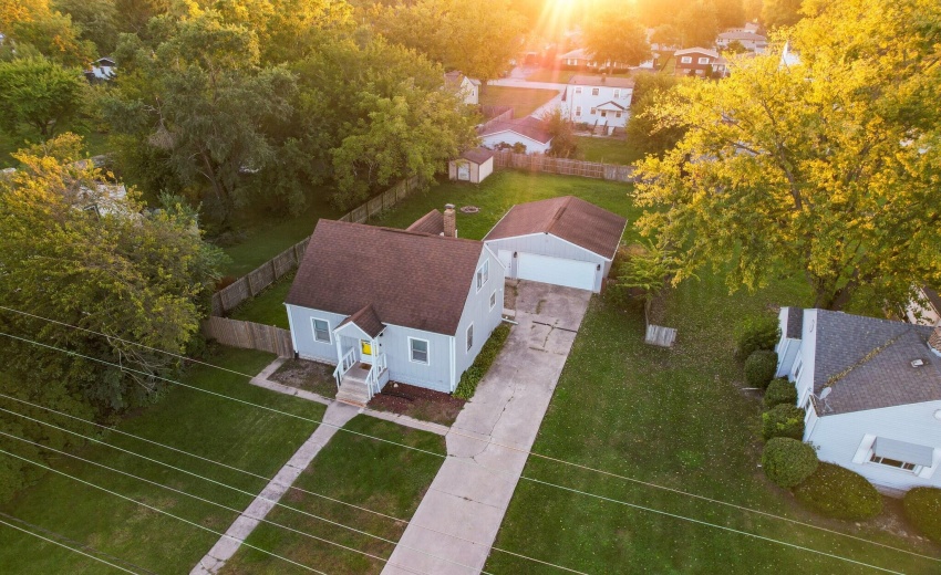 Close aerial: home, driveway, garage