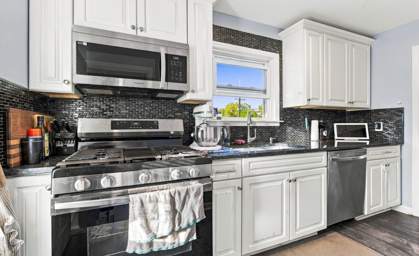 Updated kitchen, white cabinets, granite