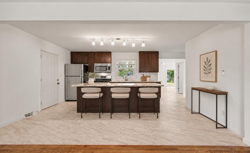 Warm wood console accents the kitchen