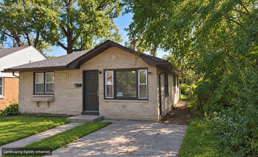 Sunlit home exterior with tidy landscapi