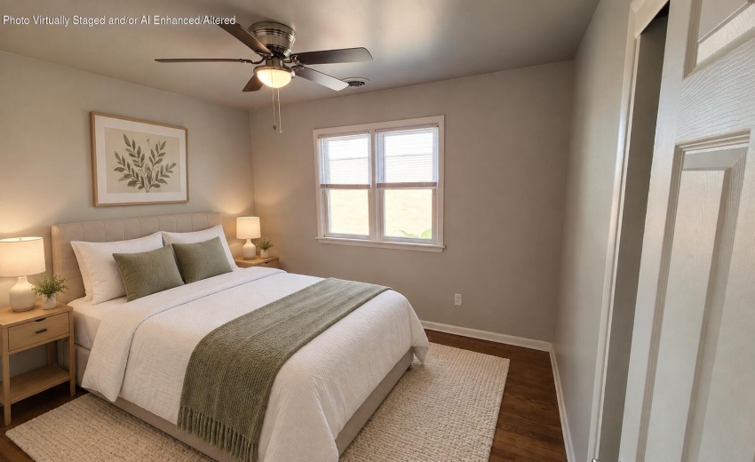 Calm staged bedroom with sage accents