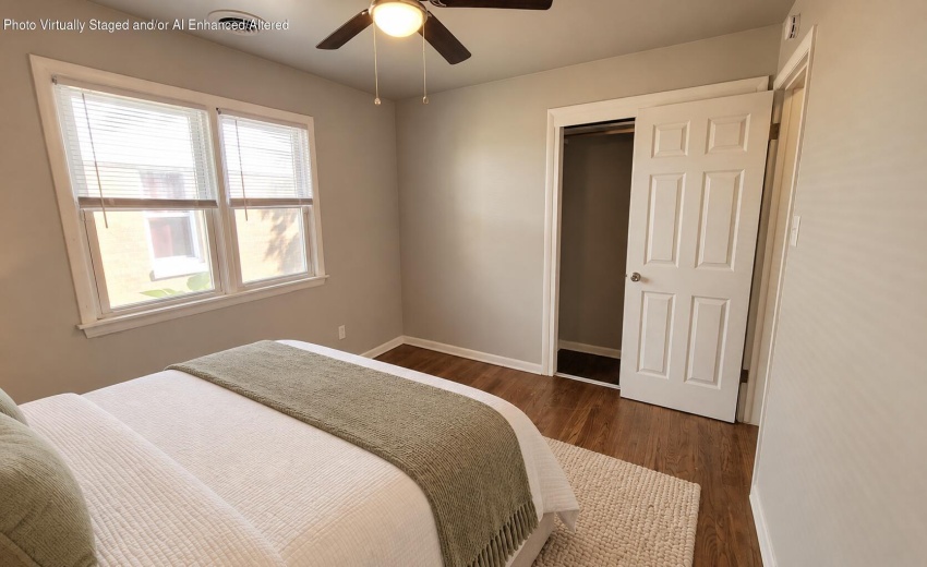 Reverse bedroom view with staged bed