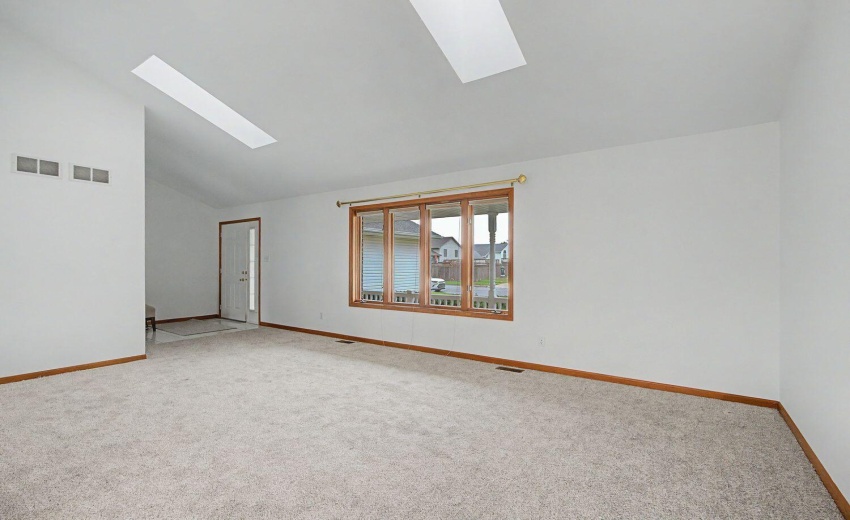 Fresh paint and carpeting in living room