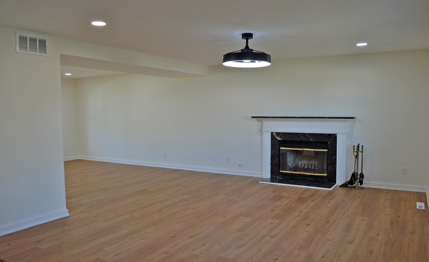 FAMILY ROOM WITH MARBLE FIREPLACE SUROUN