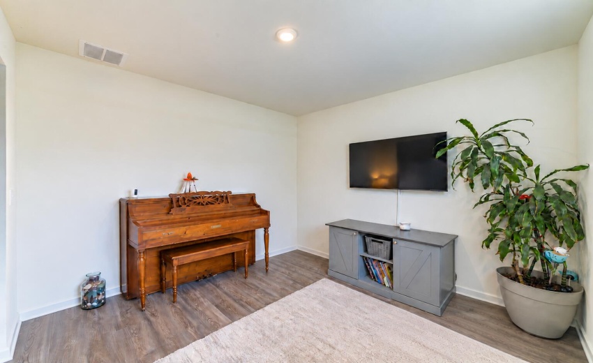 Bright room with upright piano