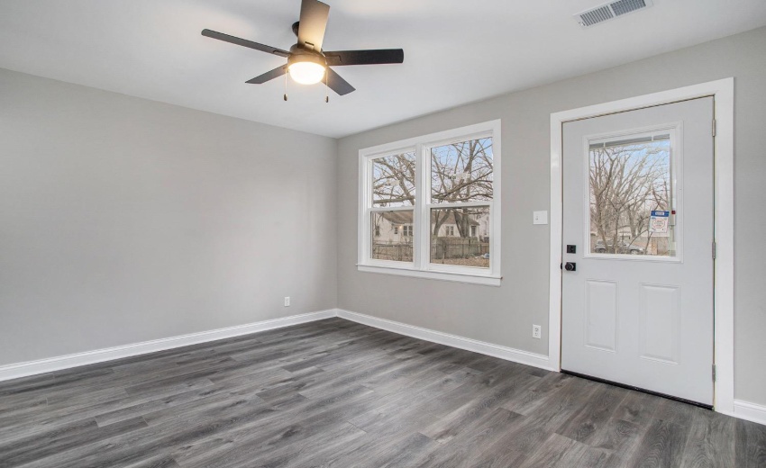 Living room has access to the backyard. New doors, windows, and vinyl plank flooring.