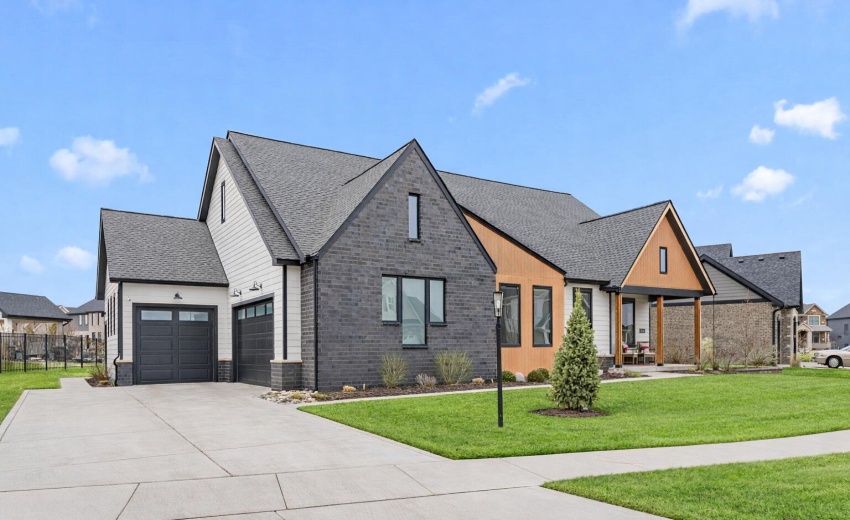 Modern suburban home with vibrant yard