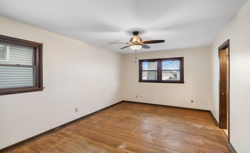 Primary bedroom with hardwood floors