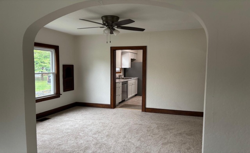 Dining room arch view of galley kitchen