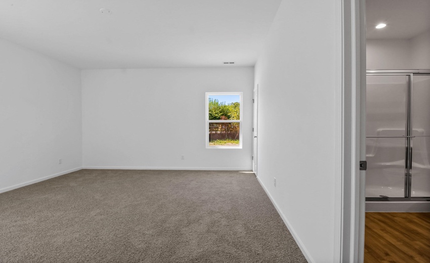 Camelia primary bedroom and bathroom