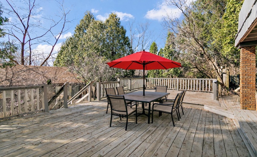 Outdoor deck with dining set and umbrell