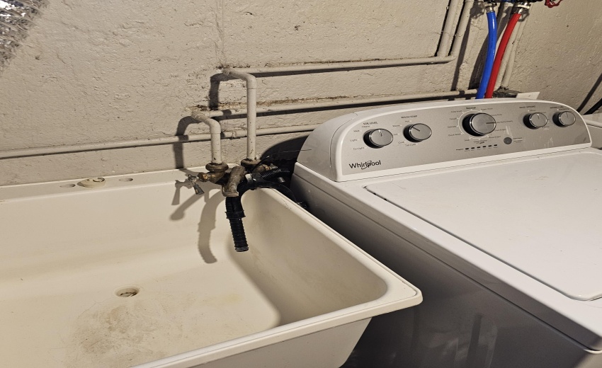 utility sink, washer drains conveniently