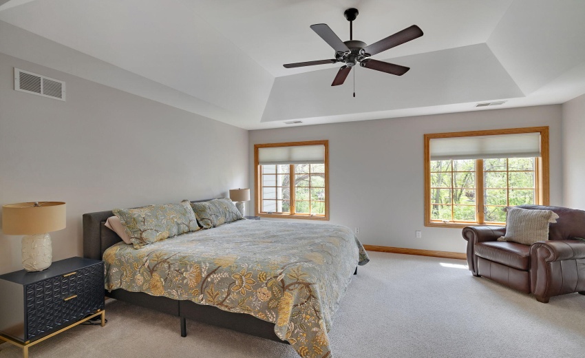 Primary bedroom with tray ceiling