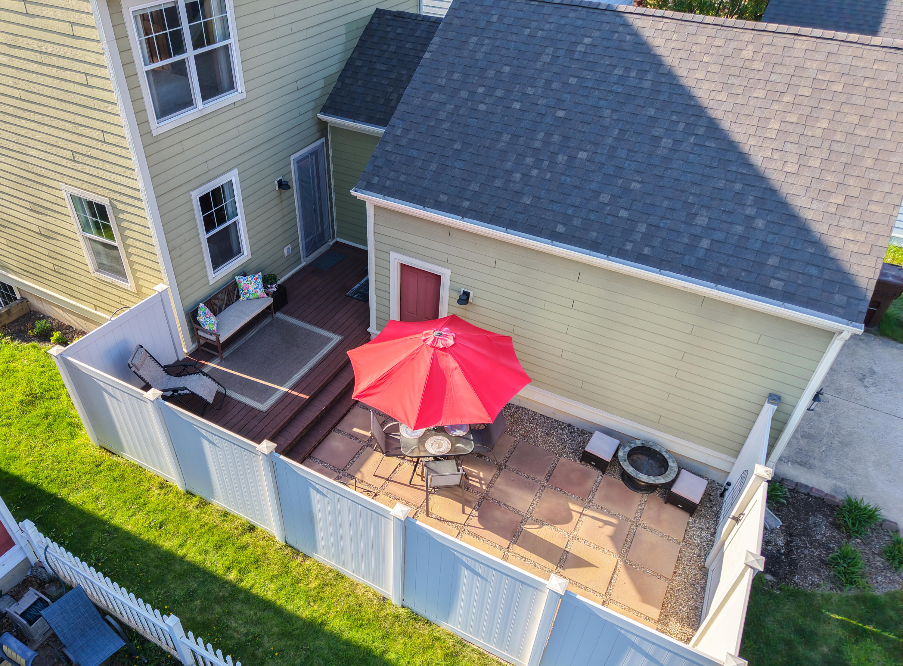 Deck steps down to stone Patio