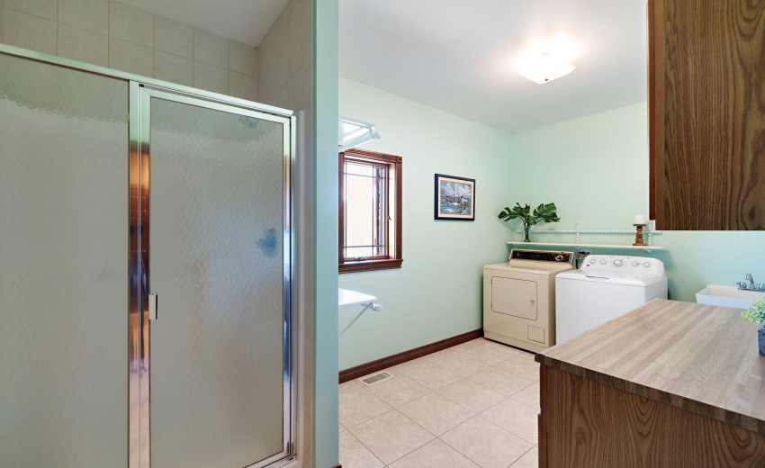 Laundry room with shower