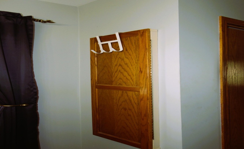 primary bed built in ironing board