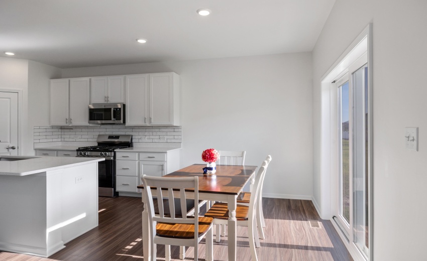 Dining and a kitchen glimpse