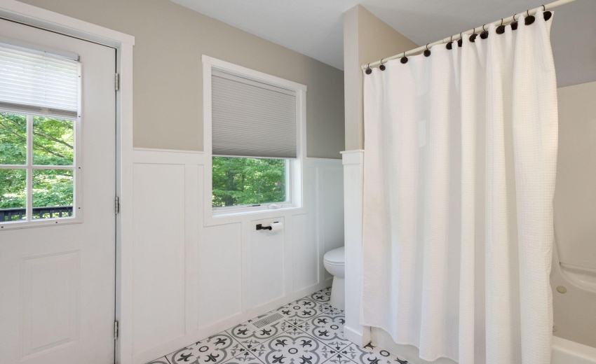 Upper Level Bathroom with a Balcony