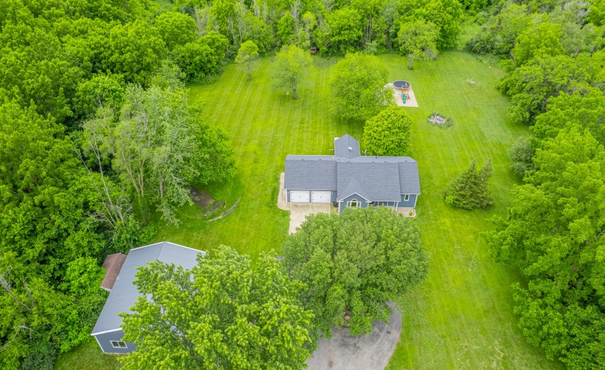 Aerial view of home & pole barn