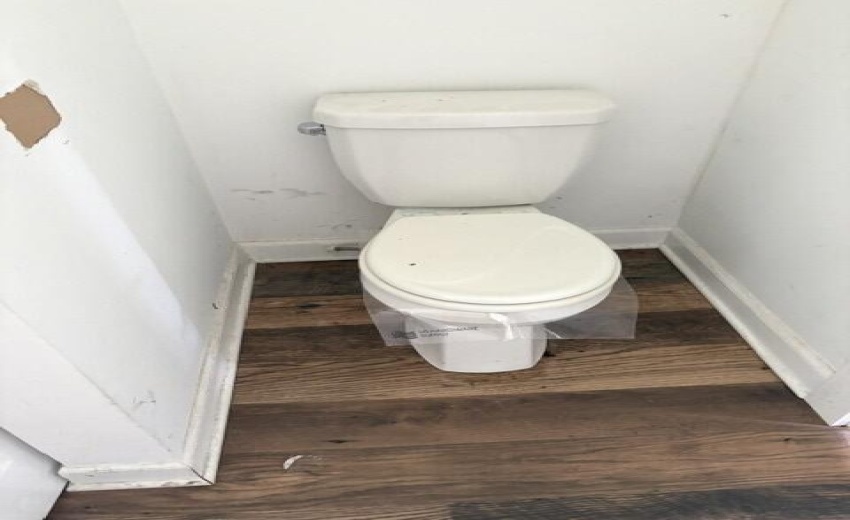 Toliet in laundry room