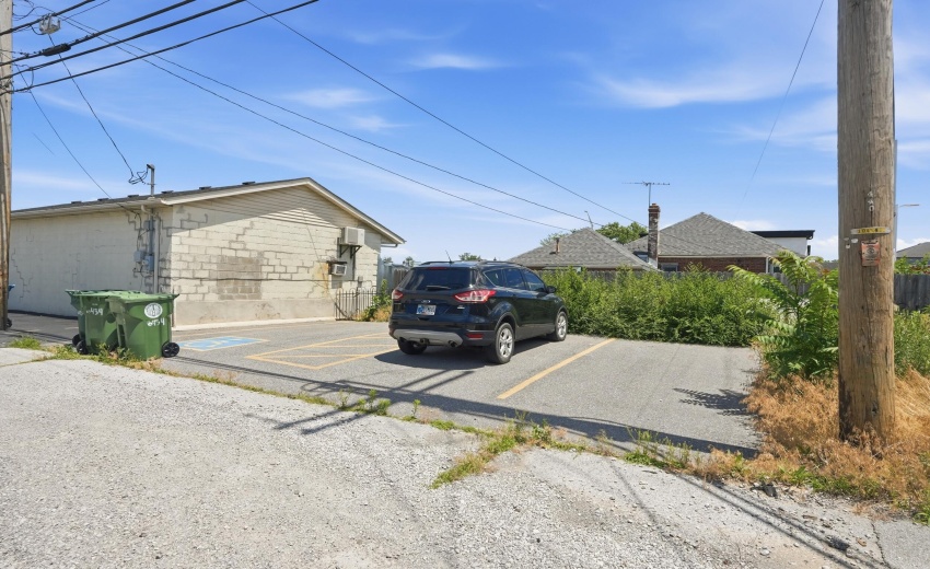 3 parking stalls off alley