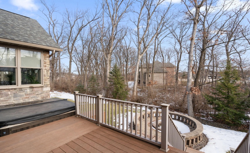Deck overlooking Firepit and Wooded Lot