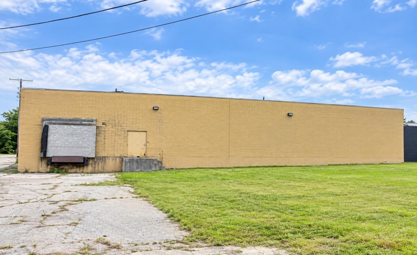 Weathered Industrial Warehouse Under Blu